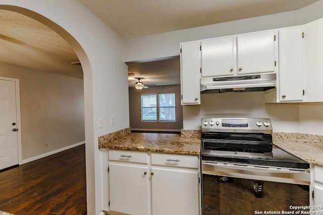 15522 Wood Sorrel, San Antonio, TX 78247 - kitchen with stainless steel electric range, under cabinet range hood, arched walkways, a ceiling fan, and white cabinets