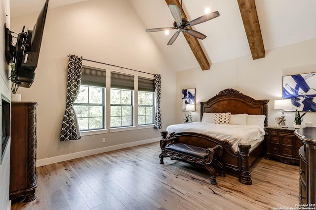 bedroom with high vaulted ceiling, light wood-style floors, baseboards, beam ceiling, and a ceiling fan