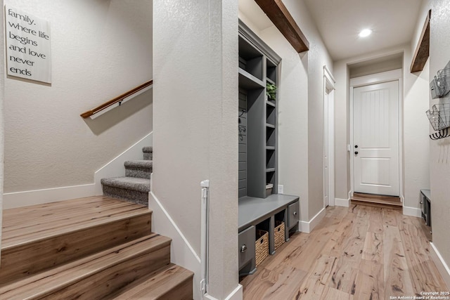 mudroom with light wood-style flooring, baseboards, and recessed lighting