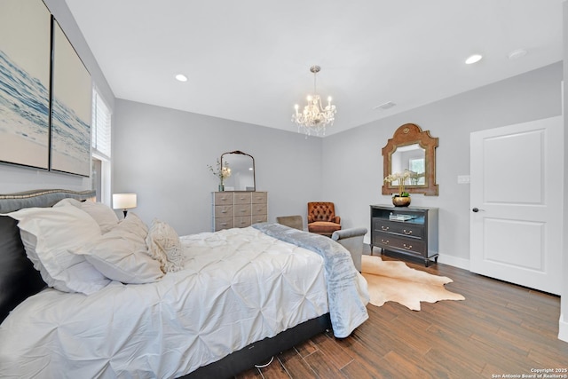 bedroom featuring a chandelier, wood finished floors, recessed lighting, and baseboards