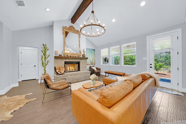 living room with beamed ceiling, baseboards, a chandelier, wood finished floors, and recessed lighting