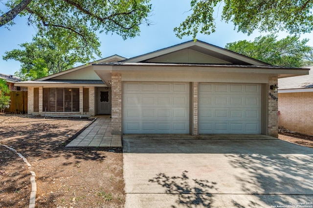 9007 Luzita Ln, San Antonio, TX 78230 - single story home with brick siding, a garage, and concrete driveway