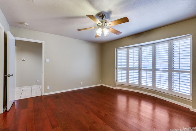 9007 Luzita Ln, San Antonio, TX 78230 - spare room with wood finished floors, plenty of natural light, a ceiling fan, and baseboards
