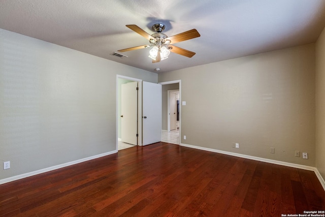 9007 Luzita Ln, San Antonio, TX 78230 - spare room featuring baseboards, ceiling fan, and wood finished floors