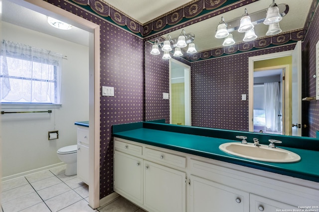9007 Luzita Ln, San Antonio, TX 78230 - bathroom with wallpapered walls, tile patterned flooring, baseboards, vanity, and toilet