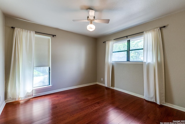 9007 Luzita Ln, San Antonio, TX 78230 - unfurnished room featuring dark wood-style floors, ceiling fan, and baseboards