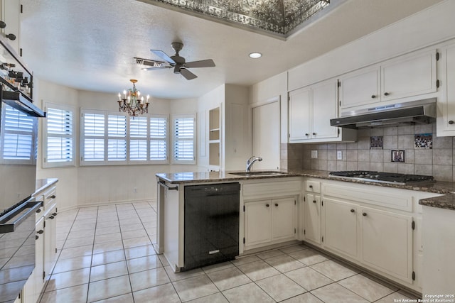 9007 Luzita Ln, San Antonio, TX 78230 - kitchen featuring dishwasher, a sink, a peninsula, under cabinet range hood, and tasteful backsplash