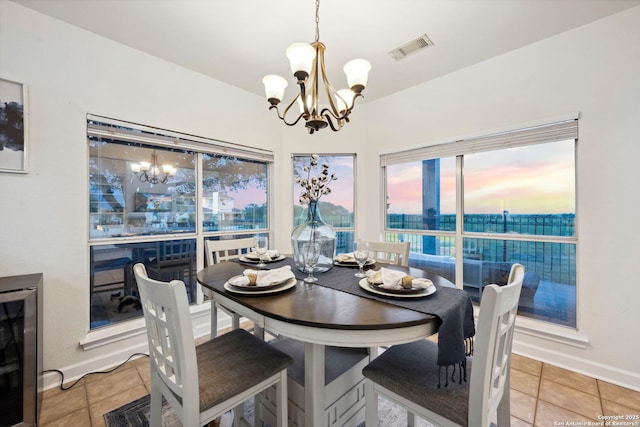 120 Seth Raynor, New Braunfels, TX 78130 - dining room featuring a chandelier, tile patterned flooring, baseboards, and beverage cooler