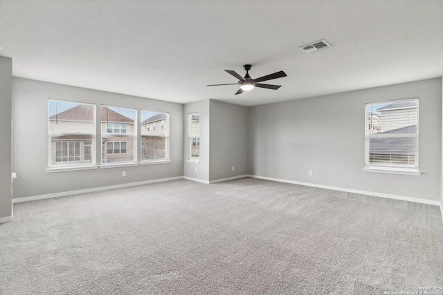 15006 Tethys Way, San Antonio, TX 78245 - spare room with carpet, baseboards, a ceiling fan, and healthy amount of natural light