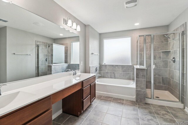 15006 Tethys Way, San Antonio, TX 78245 - full bath featuring a shower stall, tile patterned flooring, double vanity, a garden tub, and recessed lighting