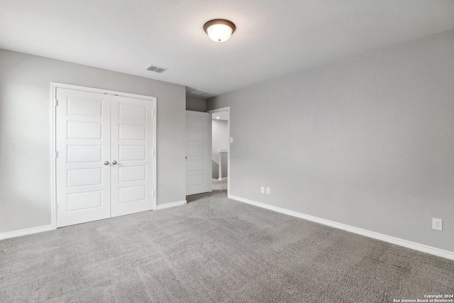 15006 Tethys Way, San Antonio, TX 78245 - unfurnished bedroom with carpet flooring, a closet, and baseboards