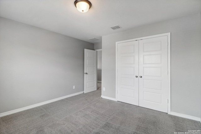 15006 Tethys Way, San Antonio, TX 78245 - unfurnished bedroom featuring a closet, carpet flooring, and baseboards