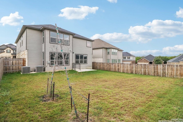 15006 Tethys Way, San Antonio, TX 78245 - back of property with central air condition unit and a patio area