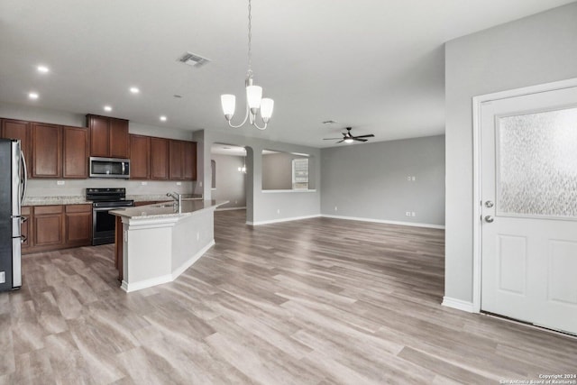 15006 Tethys Way, San Antonio, TX 78245 - kitchen with stainless steel appliances, a chandelier, ceiling fan, decorative light fixtures, and baseboards
