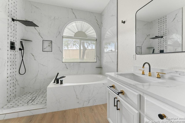 8651 Eagle Peak, Helotes, TX 78023 - bathroom featuring a marble finish shower, wood finished floors, vanity, and a bath
