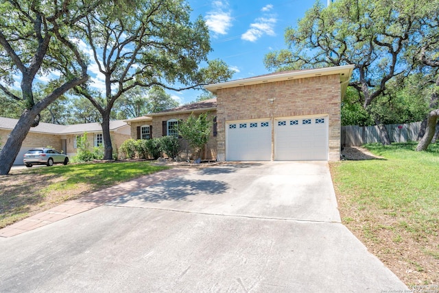 8423 Rolling Stone, San Antonio, TX 78254 - ranch-style house featuring an attached garage, brick siding, and concrete driveway