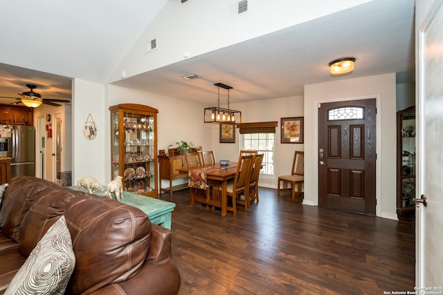 8423 Rolling Stone, San Antonio, TX 78254 - dining room with dark wood-style floors, ceiling fan, a chandelier, baseboards, and lofted ceiling