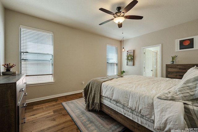 208 Cold Riv, Boerne, TX 78006 - bedroom featuring dark wood-style flooring, baseboards, and a ceiling fan