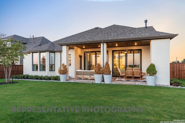 186 Lacey Oak, Castroville, TX 78009 - rear view of house featuring brick siding, ceiling fan, outdoor lounge area, and roof with shingles