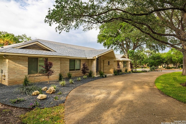 115 Wickford, Castle Hills, TX 78213 - view of front of property with a shingled roof and brick siding