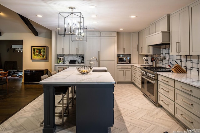 115 Wickford, Castle Hills, TX 78213 - kitchen with double oven range, a sink, a chandelier, light stone counters, and a center island with sink