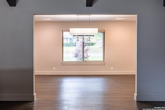 115 Wickford, Castle Hills, TX 78213 - unfurnished dining area with baseboards and dark wood-style flooring