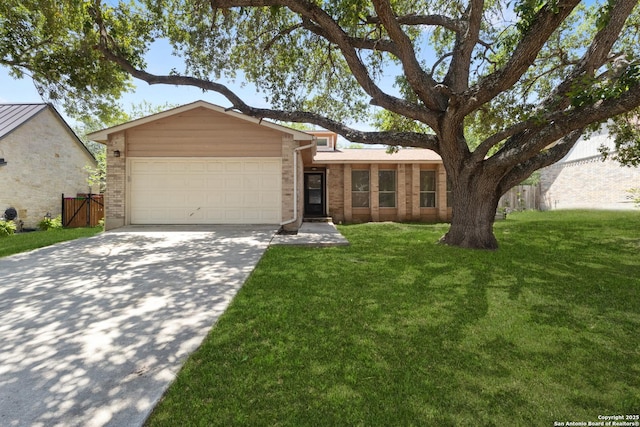 mid-century inspired home with a garage, concrete driveway, brick siding, and a front yard