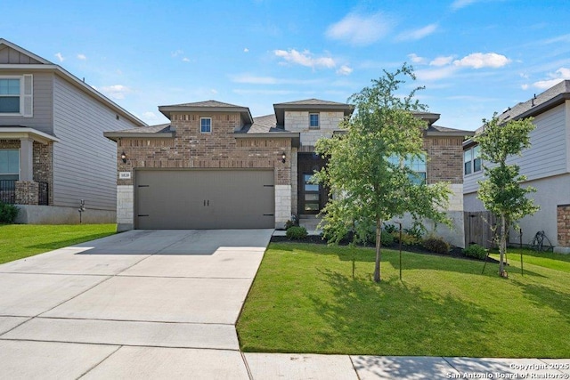view of front of home featuring stone siding, an attached garage, and a front yard