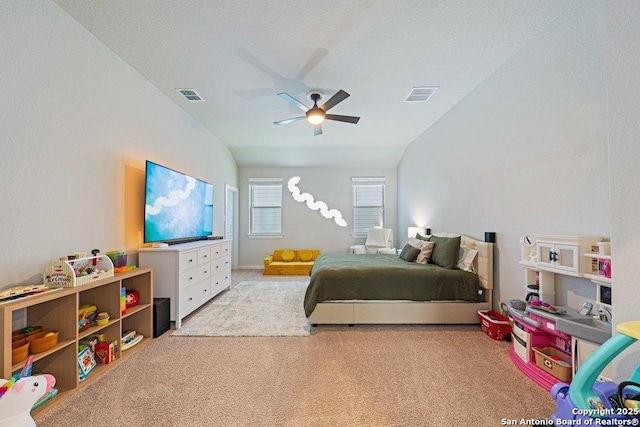 bedroom with carpet flooring, lofted ceiling, and a ceiling fan