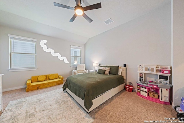 carpeted bedroom with lofted ceiling and a ceiling fan