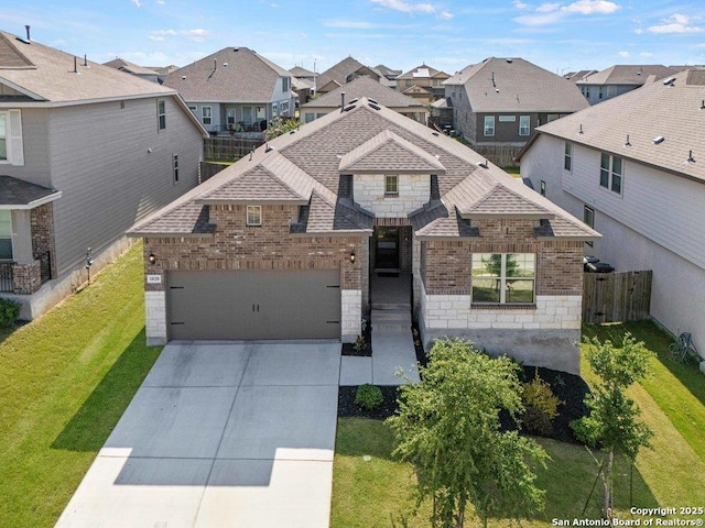 view of front facade featuring brick siding, a residential view, a garage, and stone siding