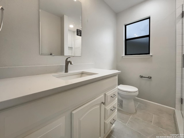 bathroom featuring vanity, toilet, a shower, and tile patterned flooring
