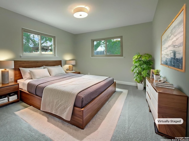 bedroom featuring carpet floors and baseboards