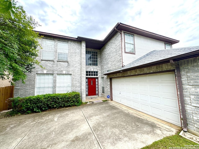 10511 Pemspice, San Antonio, TX 78240 - view of front facade featuring driveway, an attached garage, and brick siding