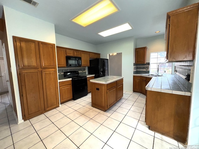 10511 Pemspice, San Antonio, TX 78240 - kitchen featuring black appliances, tile countertops, backsplash, and recessed lighting