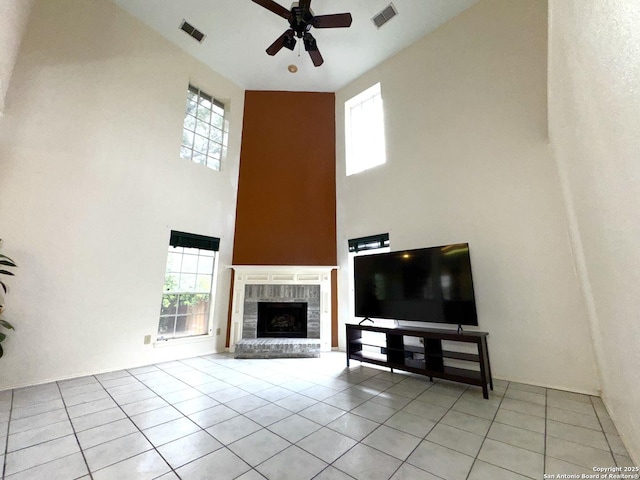 10511 Pemspice, San Antonio, TX 78240 - living room with a high ceiling, light tile patterned floors, a ceiling fan, a brick fireplace, and plenty of natural light