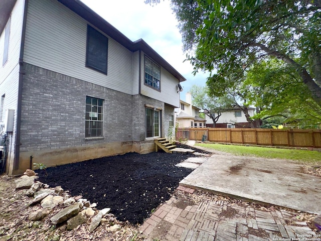 10511 Pemspice, San Antonio, TX 78240 - rear view of property featuring fence, brick siding, and a patio