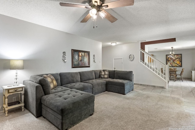 7705 Wood Blf, San Antonio, TX 78240 - carpeted living room with stairs, a textured ceiling, ceiling fan, and tile patterned floors