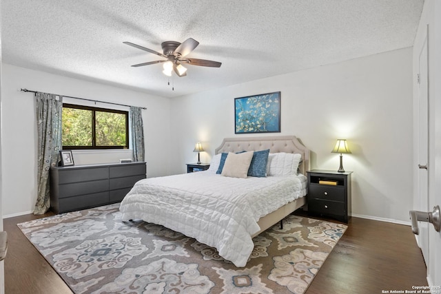 7705 Wood Blf, San Antonio, TX 78240 - bedroom with wood finished floors, baseboards, a textured ceiling, and a ceiling fan