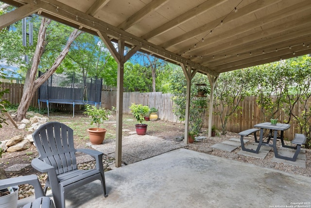 7705 Wood Blf, San Antonio, TX 78240 - view of patio / terrace with a trampoline and a fenced backyard