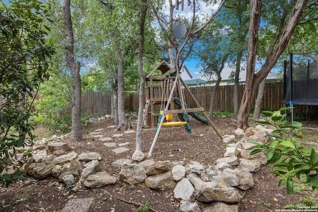 7705 Wood Blf, San Antonio, TX 78240 - view of jungle gym with a trampoline and a fenced backyard