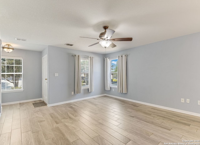 11455 Country Cyn, San Antonio, TX 78252 - unfurnished room with ceiling fan, light wood-type flooring, and baseboards