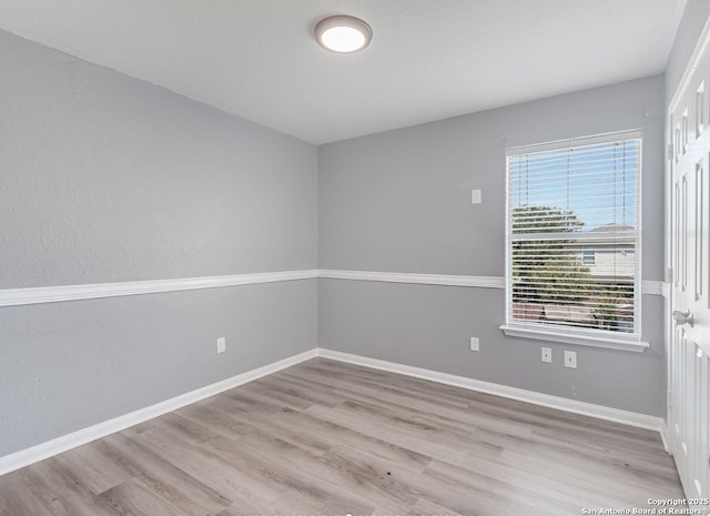 11455 Country Cyn, San Antonio, TX 78252 - unfurnished room with wood finished floors and baseboards