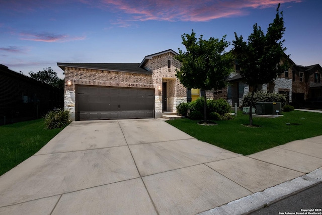 13009 Maridell Park, San Antonio, TX 78253 - french country home featuring driveway, a lawn, a garage, and stone siding