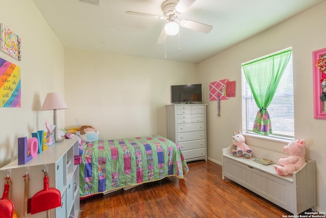 bedroom featuring wood finished floors and a ceiling fan