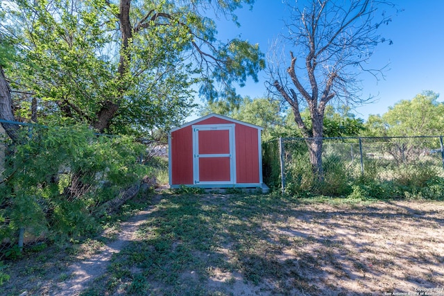 view of shed with fence