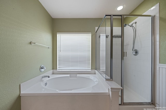 3738 Sumantra, San Antonio, TX 78261 - full bathroom featuring a shower stall, a bath, and a textured wall