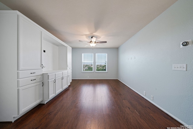 3738 Sumantra, San Antonio, TX 78261 - unfurnished living room with a ceiling fan, dark wood-style floors, and baseboards