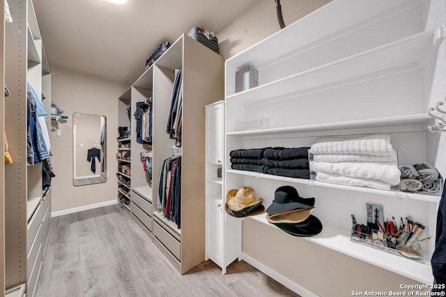 13410 Canyon Mdws, San Antonio, TX 78254 - walk in closet with light wood finished floors