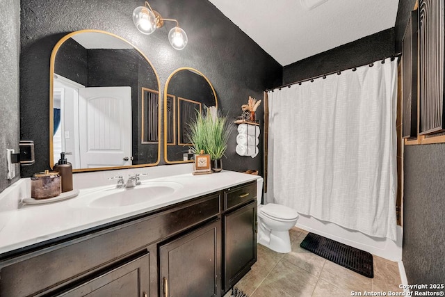 13410 Canyon Mdws, San Antonio, TX 78254 - bathroom featuring a textured wall, vanity, toilet, tile patterned flooring, and shower / bath combo with shower curtain